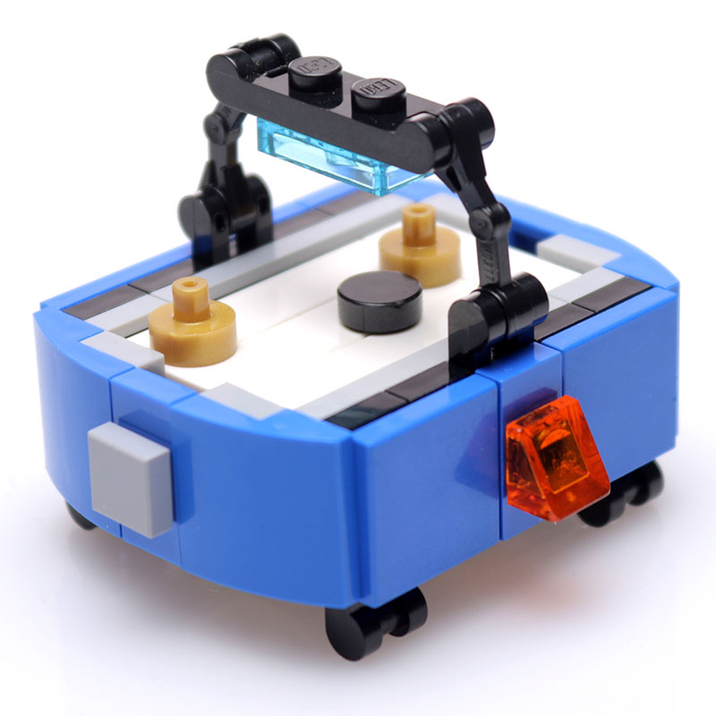 Custom Air Hockey Table 52-Piece Building Set made from LEGO parts - B3 Customs features a miniature blue air hockey table designed with authentic LEGO bricks, perfect for LEGO displays.