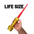 Hand holding the Life-Size Emperor-Style Brick Blade — Gold Finish with Retractable Red Blade by B3 Customs, showcasing its detailed gold hilt and extended red blade.