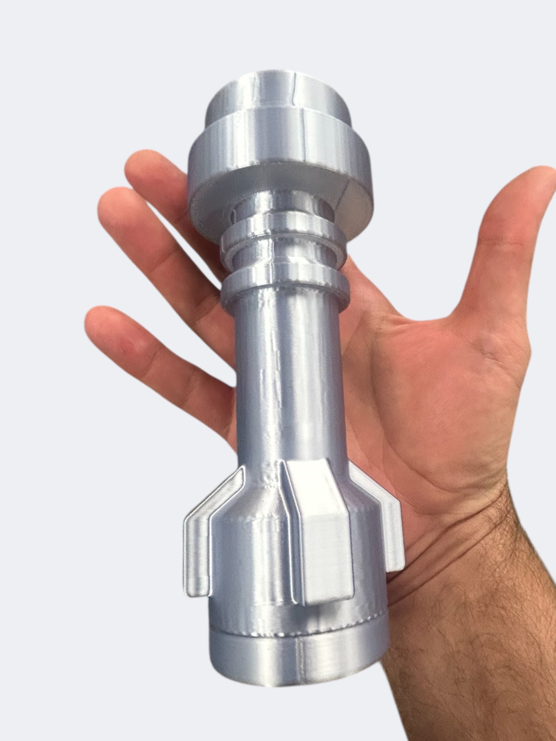Hand holding a silver 3D-printed lightsaber hilt replica part from the Life-Size Blue Saber with Retractable Blue Blade / Cosplay by B3 Customs.