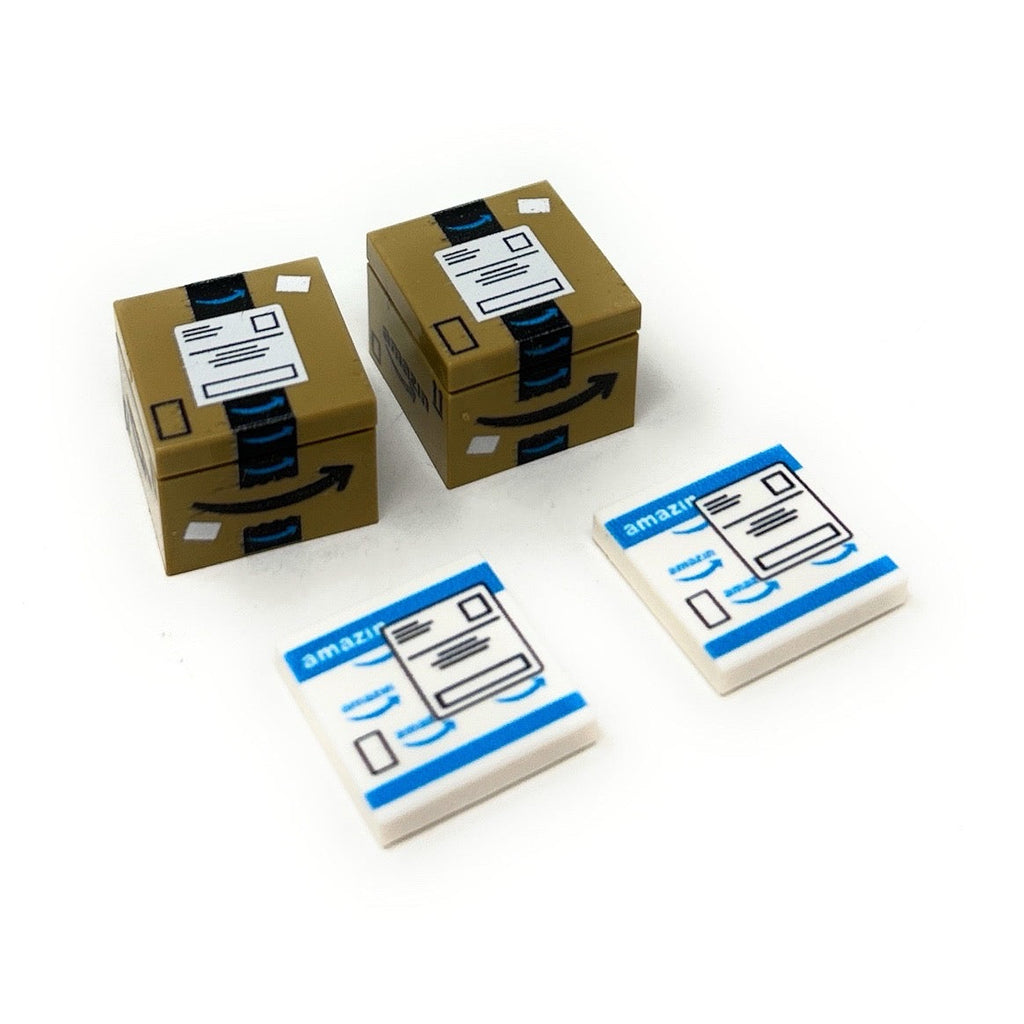 Two small LEGO shipping boxes and two flat LEGO tiles featuring printed shipping labels, part of The Amazin Shipping Boxes Pack made with LEGO parts.