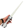 Hand holding a Life-Size White Saber with Retractable Blade / Cosplay by B3 Customs, showcasing its detailed brick-style hilt and sleek white blade, perfect for cosplay enthusiasts.