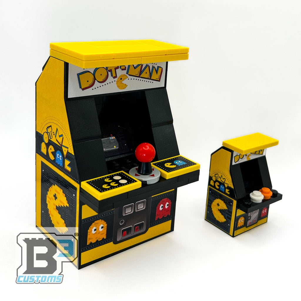 GIANT! Dot-Man Arcade Machine made using LEGO parts - B3 Customs features a large yellow and black arcade replica with classic Dot-Man graphics, joystick, and buttons, alongside a smaller version, showcasing detailed brick mocs by B3 Customs.