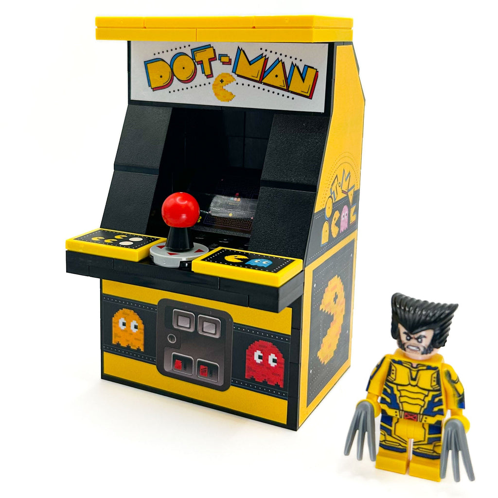GIANT! Dot-Man Arcade Machine made using LEGO parts - B3 Customs features a detailed yellow and black arcade with classic pixel art and includes a Wolverine custom minifigure by B3 Customs.