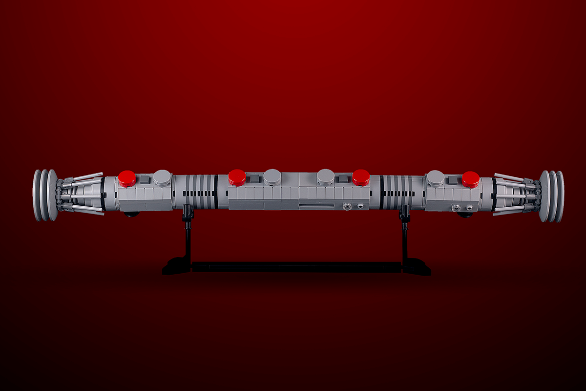 Maul Saber w/ Stand - Custom MOC made with LEGO bricks by B3 Customs, showcasing a detailed life-size LEGO brick lightsaber on a black display stand against a red background.