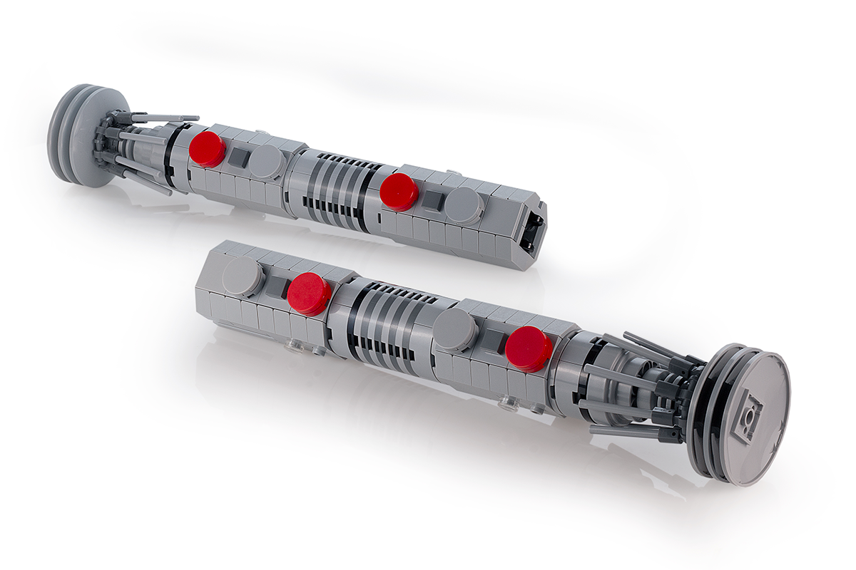 Maul Saber w/ Stand - Custom MOC made with LEGO bricks by B3 Customs, featuring a detailed replica of a dual lightsaber hilt with red and gray LEGO pieces.