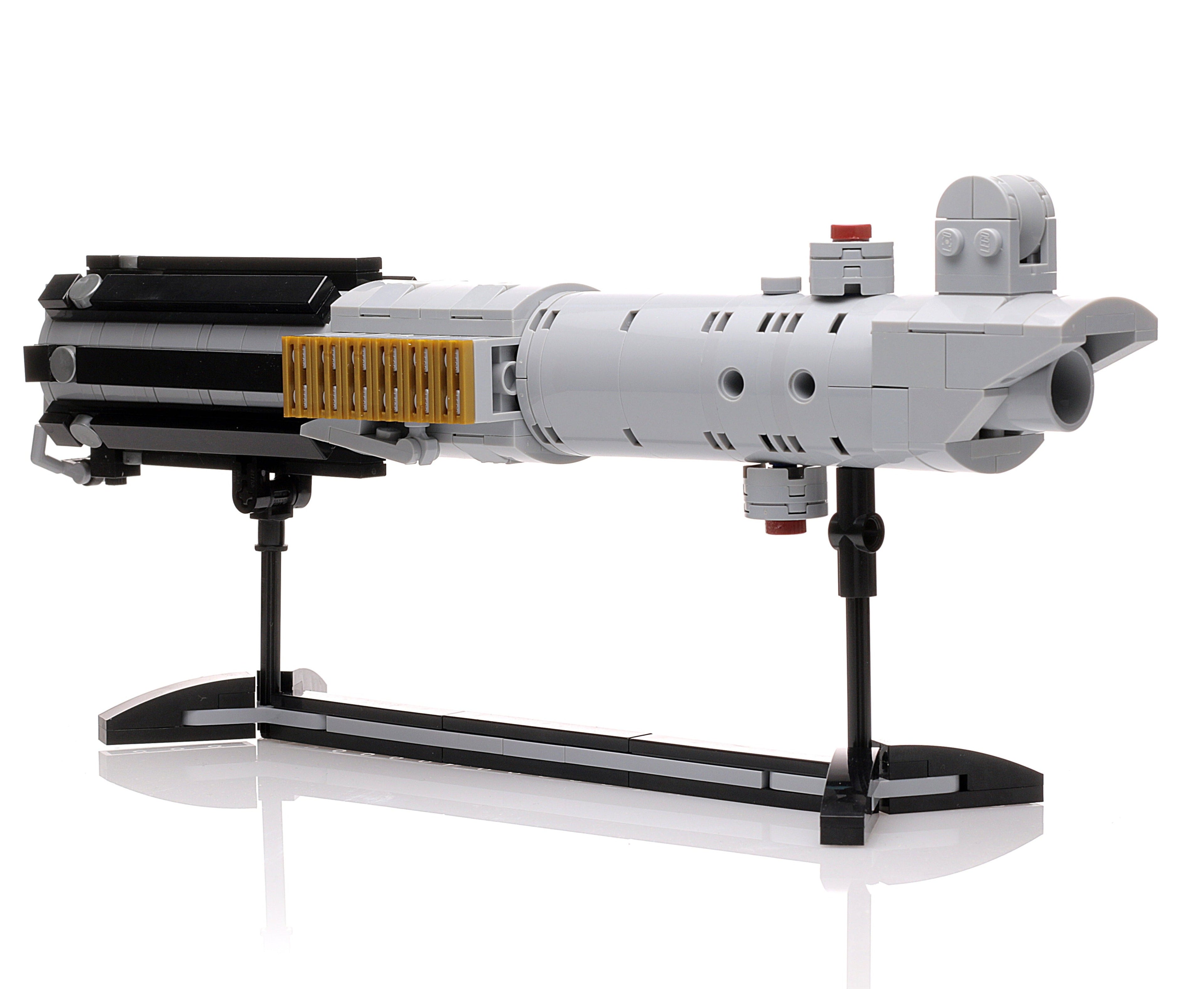 Luke Skywalker's A New Hope Lightsaber w/ Stand made using LEGO parts (Life-Size) displayed on a black stand, crafted by B3 Customs with detailed brick construction.