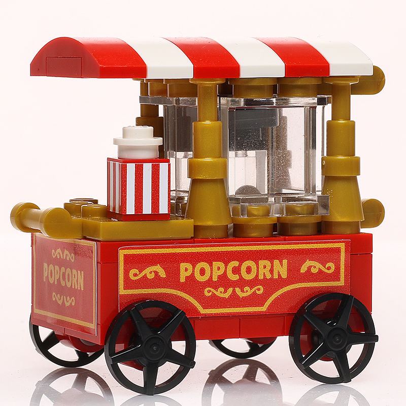 Detailed Popcorn Vending Cart Building Set made using LEGO parts by B3 Customs, featuring red and white striped canopy, popcorn dispenser, and black wheels for LEGO minifigures.