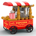 Red and white striped Popcorn Vending Cart Building Set made using LEGO parts by B3 Customs, featuring detailed popcorn machine and decorative yellow and black wheels.