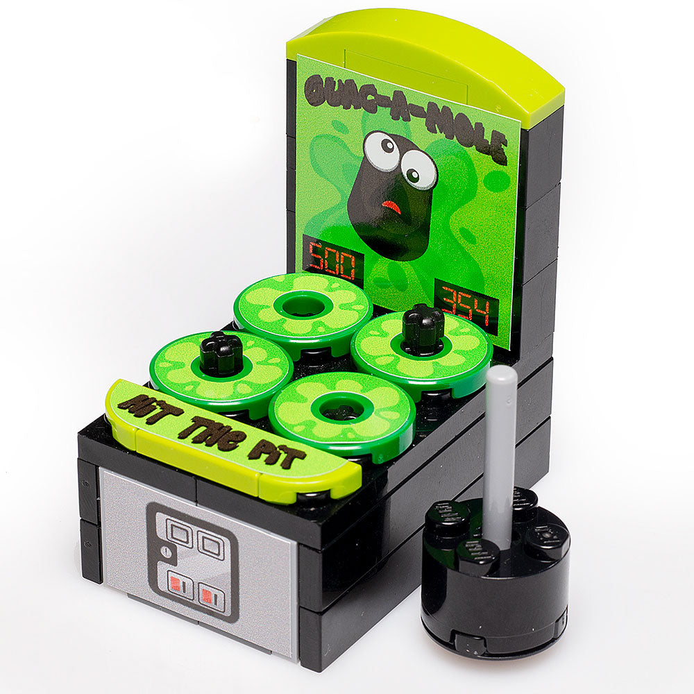 Guac-A-Mole - Custom Arcade Whac-A-Mole Set made using LEGO parts - B3 Customs showcases a green-themed LEGO arcade game with animated mole targets and a mallet for hitting.