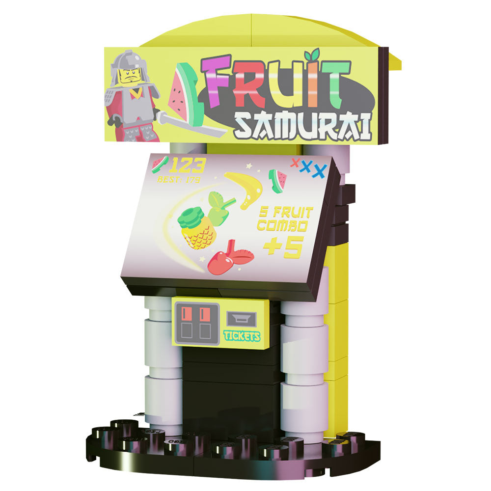 Miniature arcade game model with colorful fruit graphics and a samurai LEGO minifigure, part of the Fruit Samurai Arcade Building Set made using LEGO parts - B3 Customs.