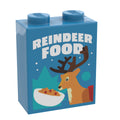 Blue custom lego brick styled as a "Reindeer Food Box (1x2x2 Brick) - B3 Customs" featuring a cartoon reindeer and cereal bowl illustration on the front.