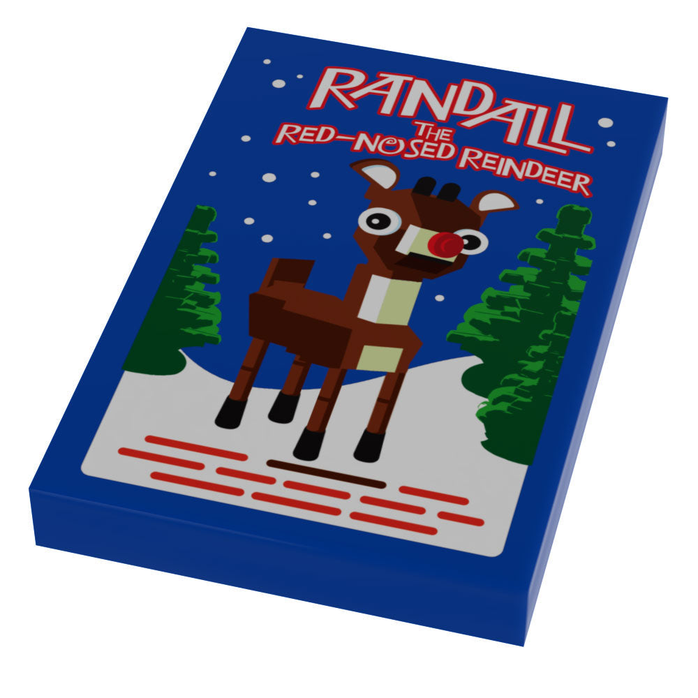 Box featuring a custom LEGO design of a red-nosed reindeer standing in a snowy forest with pine trees, titled Red-Nosed Reindeer Christmas Movie Cover (2x3 Tile).