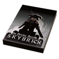 Skybrick: The Bricky Scrolls Video Game Cover (2x3 Tile) - B3 Customs showcasing a custom Lego figure in a fantasy warrior outfit with dual swords against a dark, smoky background.