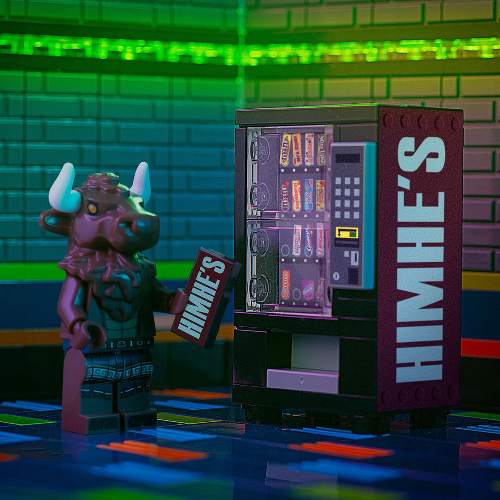 A custom LEGO vending machine with detailed printed tiles beside a minifigure holding a HimHe's sign, showcasing HimHe's - B3 Customs® Candy Vending Machine made using LEGO parts by B3 Customs.