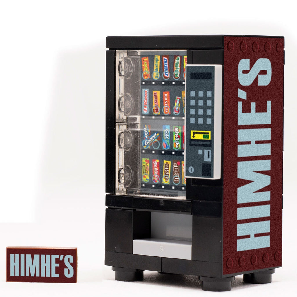 A detailed HimHe's - B3 Customs® Candy Vending Machine made using LEGO parts with colorful candy selection, featuring the B3 Customs logo on the side and custom printed design.
