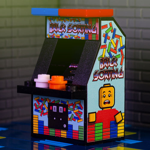 Miniature Brick Sorting Classic Arcade Machine by B3 Customs featuring colorful brick-themed artwork and LEGO-inspired design with red and blue buttons on the control panel.