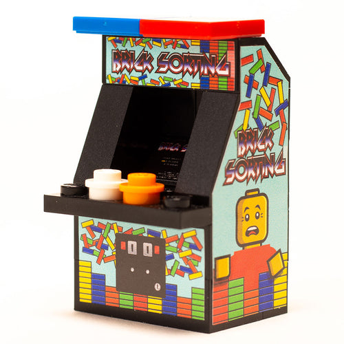 A miniature Brick Sorting Classic Arcade Machine by B3 Customs featuring colorful brick-themed artwork, a Lego arcade design with detailed buttons and a character illustration.