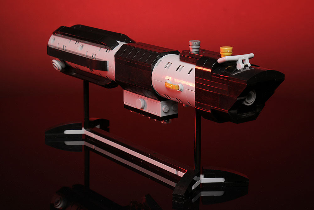 Life Size Darth Vader's Saber Hilt w/ Stand by B3 Customs, a detailed LEGO replica featuring 248 bricks, displayed on a sleek black stand against a red background.
